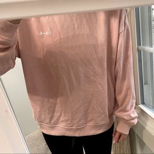 Pink crewneck with LOVE written on the chest